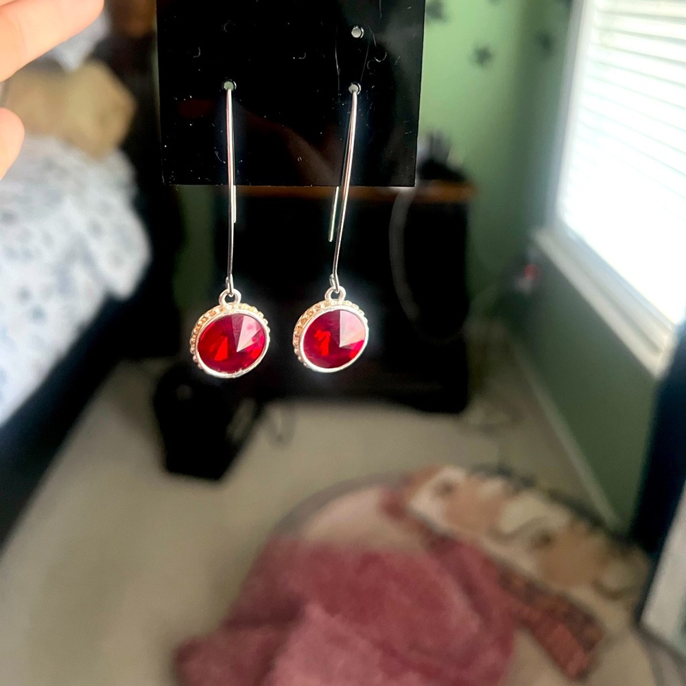 Ruby birthstone dangle earrings.
